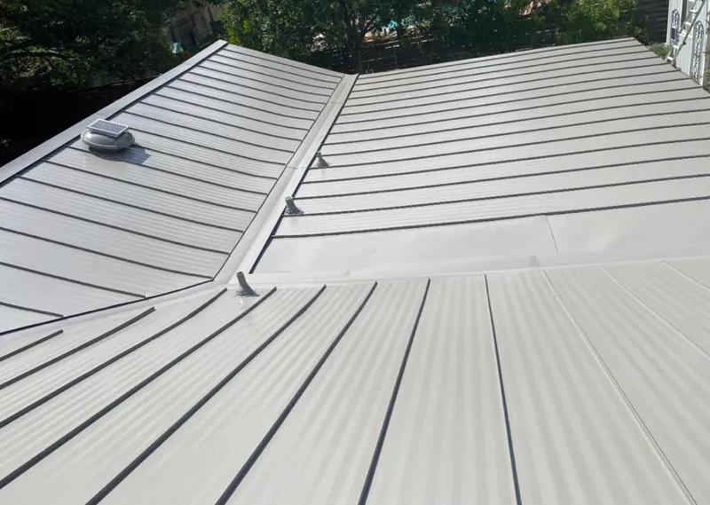Solar attic fan installed on a metal roof for Roof Ventilation in Kahaluu